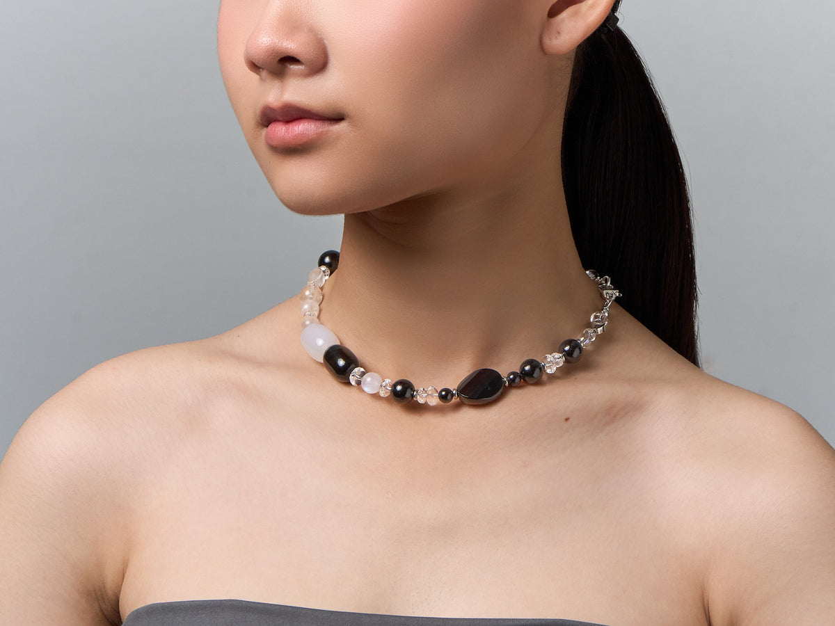 The Yin Yang worn as a necklace at the neck