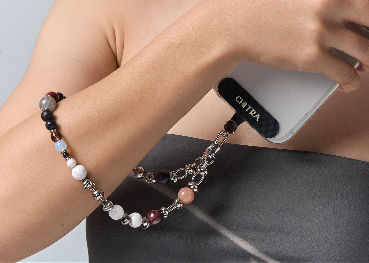 The Empower and Protect clipped to a phone and held at the shoulder