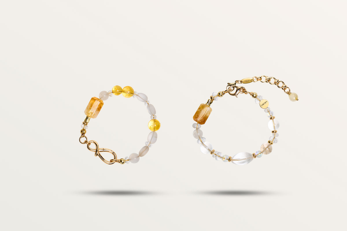 The Golden Winter split into its two bracelets, honey and milky stones on gold-tone hardware