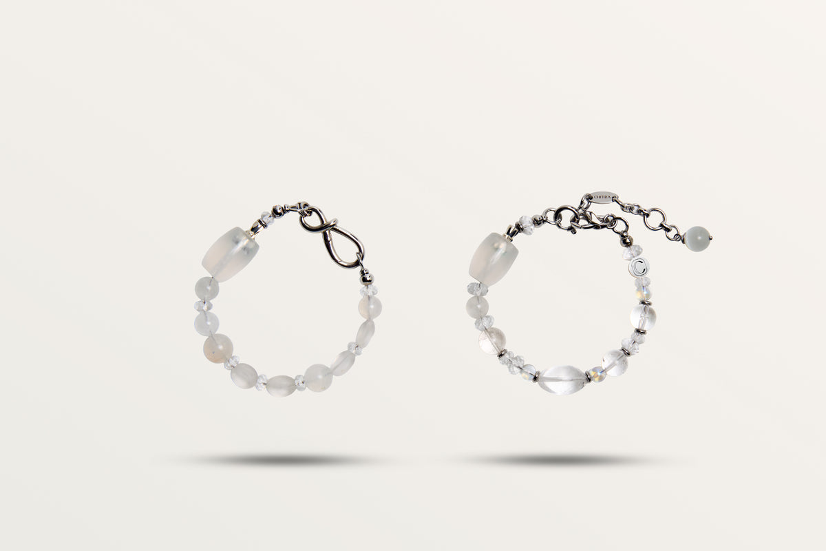 The Queen of Winter split into its two bracelets, frosted and clear white stones