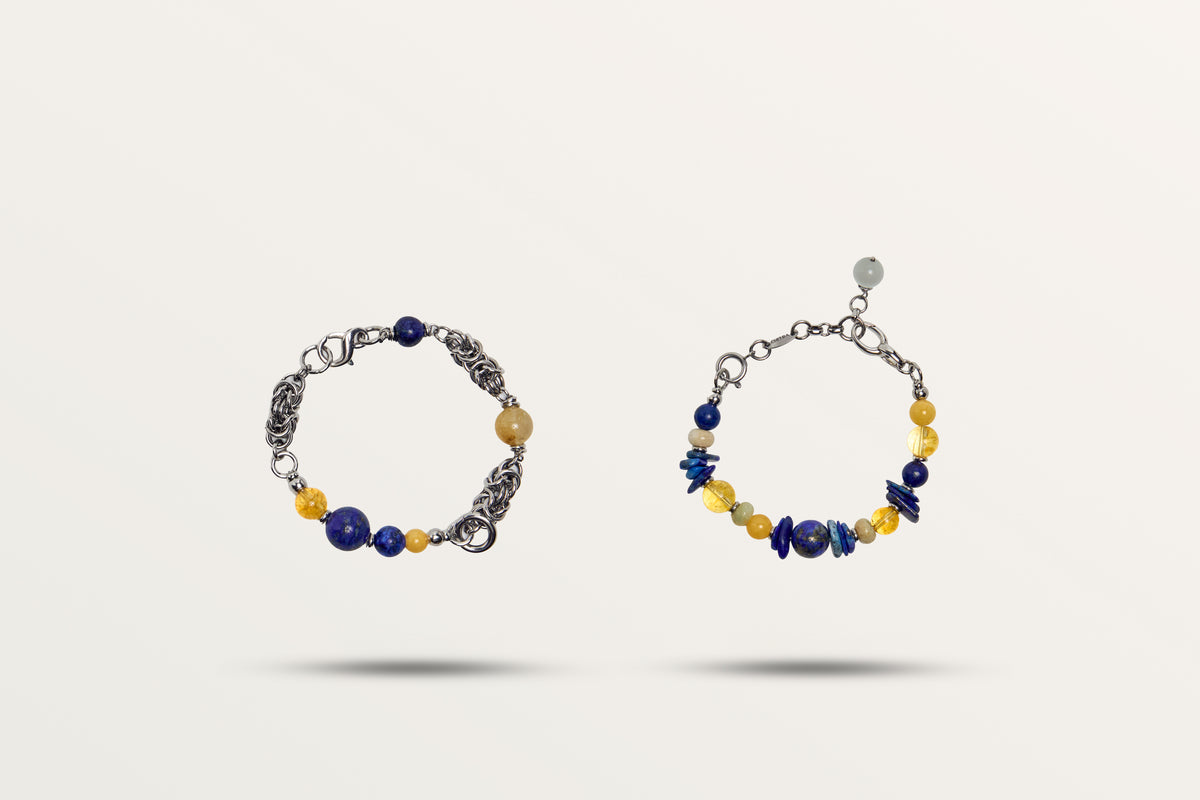 The Moon Phase split into its two bracelets, deep blue and yellow stones with a woven steel chain