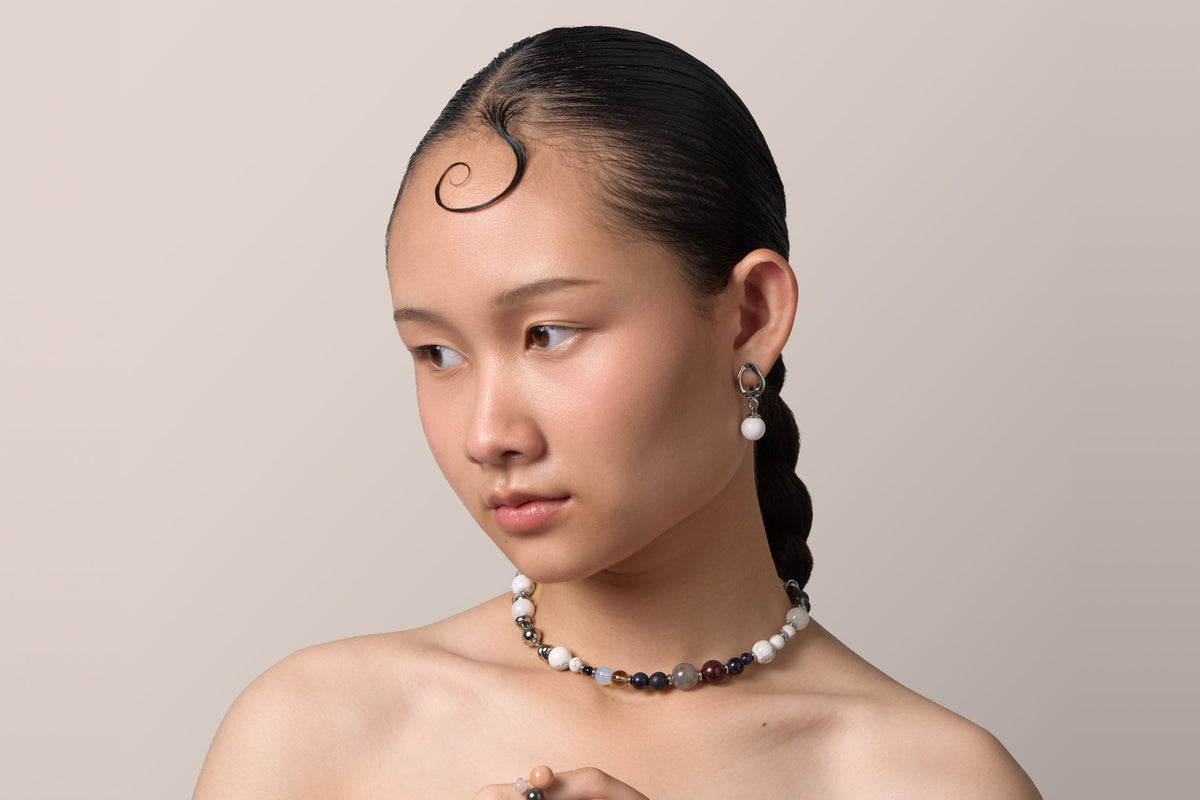 The Empower and Protect worn as a necklace at the neck