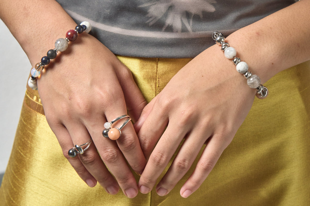 The Empower and Protect worn as a bracelet, with rings