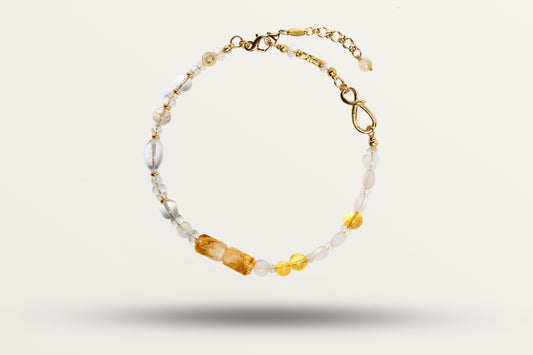The Golden Winter as a necklace, one closed loop of honey and milky stones on gold-tone hardware