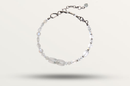 The Queen of Winter as a necklace, one closed loop of frosted and clear white stones