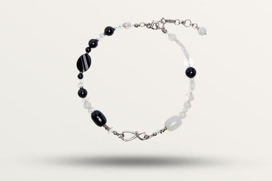 The Yin Yang as a necklace, one closed loop of black and white stones